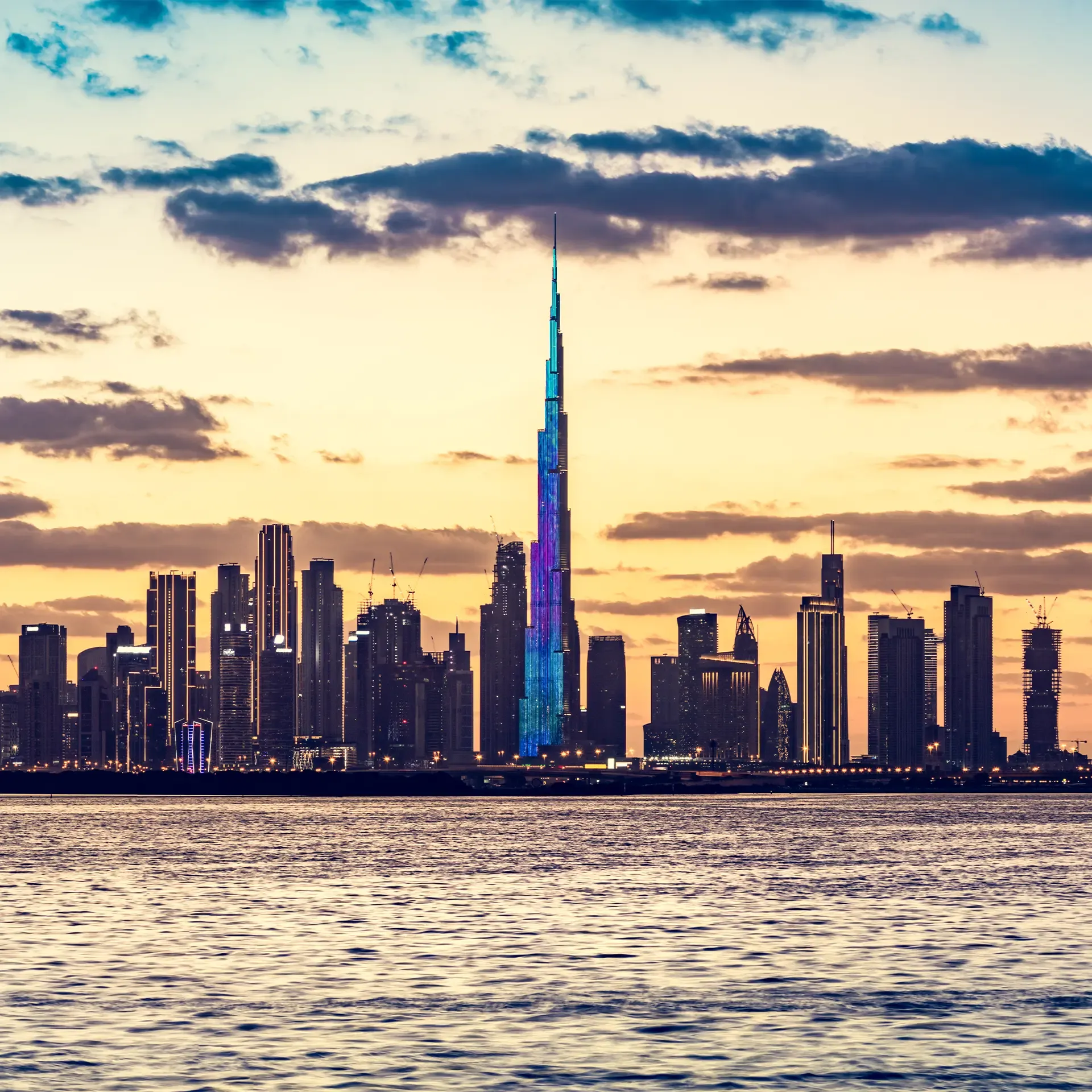 A modern view of the Dubai skyline, illustrating an investor's guide to understanding UAE VAT and corporate tax on real estate.